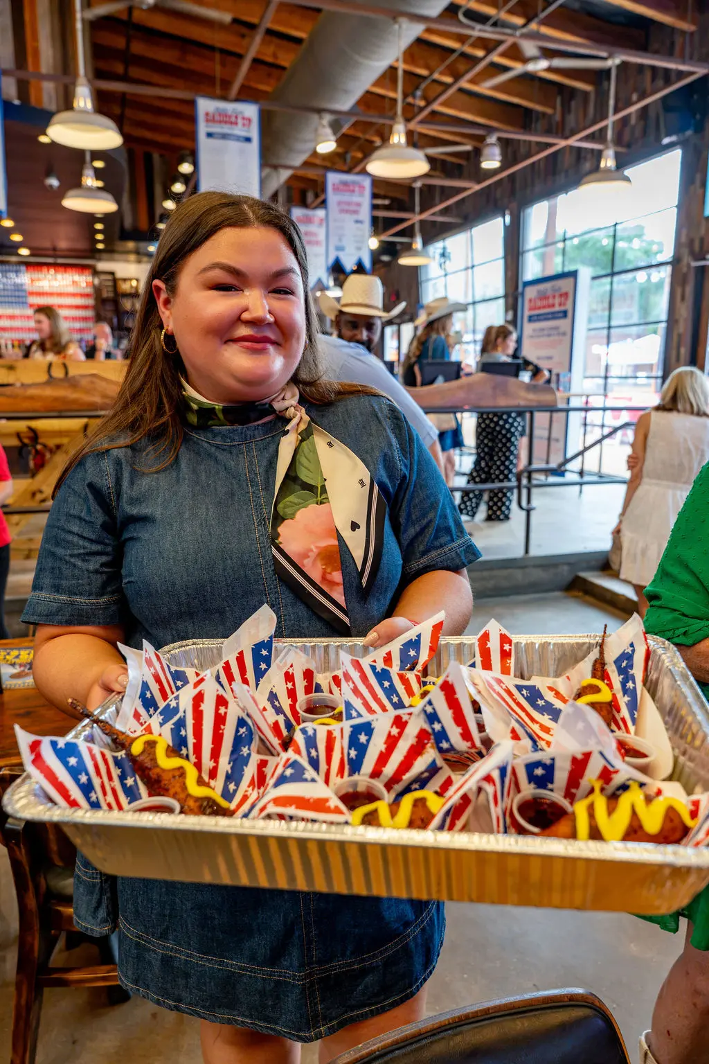 Emma Fletcher of Fletcher's Corny Dogs was handing out corn dogs to guests at Saddle Up. (Photo by Imani Black)