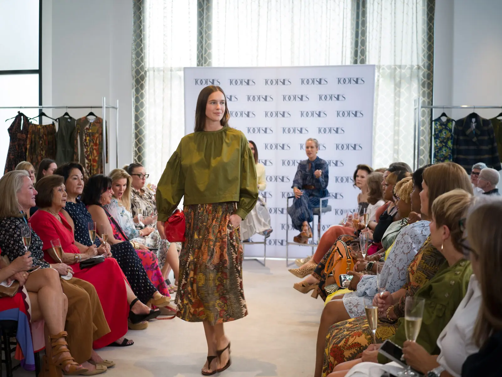 Hunter Bell's Fall 2026 fashions on display at the Women of Wardrobe's 23rd annual Summer Soiree at Tootsies