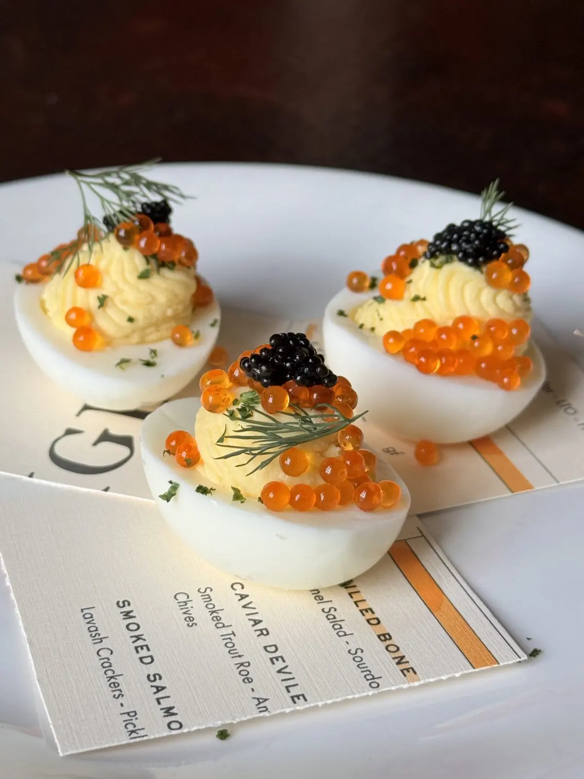 Chef Marcus Paslay’s Clay Pigeon serves Caviar Deviled Eggs topped with smoked trout roe, American Sturgeon caviar, and chives. (Photo courtesy Clay Pigeon)