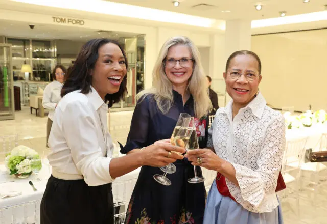 Gina Gaston, Amy Pierce, Merele Yarborough get into the spirit at the Houston Best Dressed Hall of Fame luncheon hosted by Neiman Marcus in the couture salon. (Photo by Priscilla Dickson)