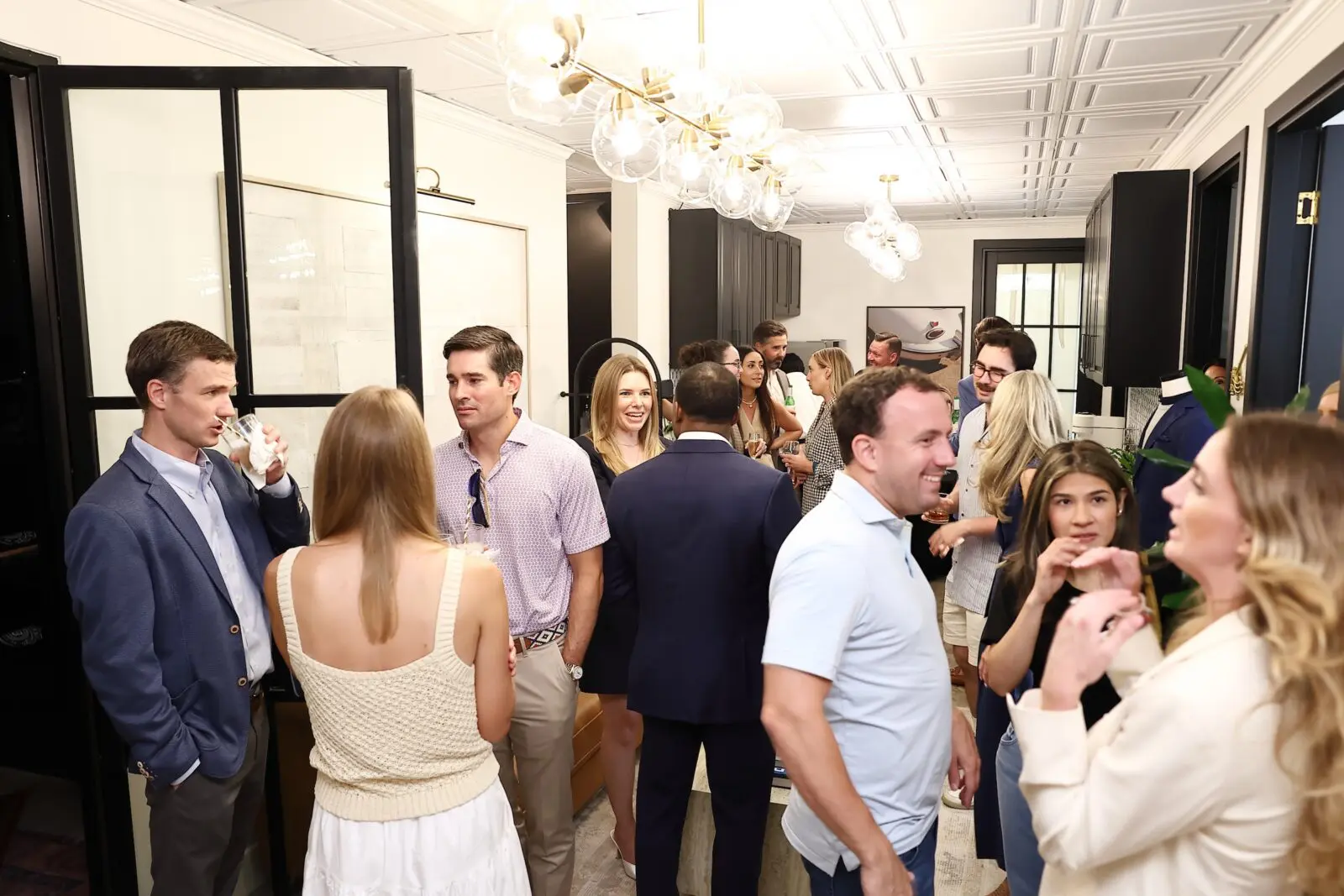 Guests enjoy the lively scene at the Ghurka Houston opening night party (Photo by Quy Tran)