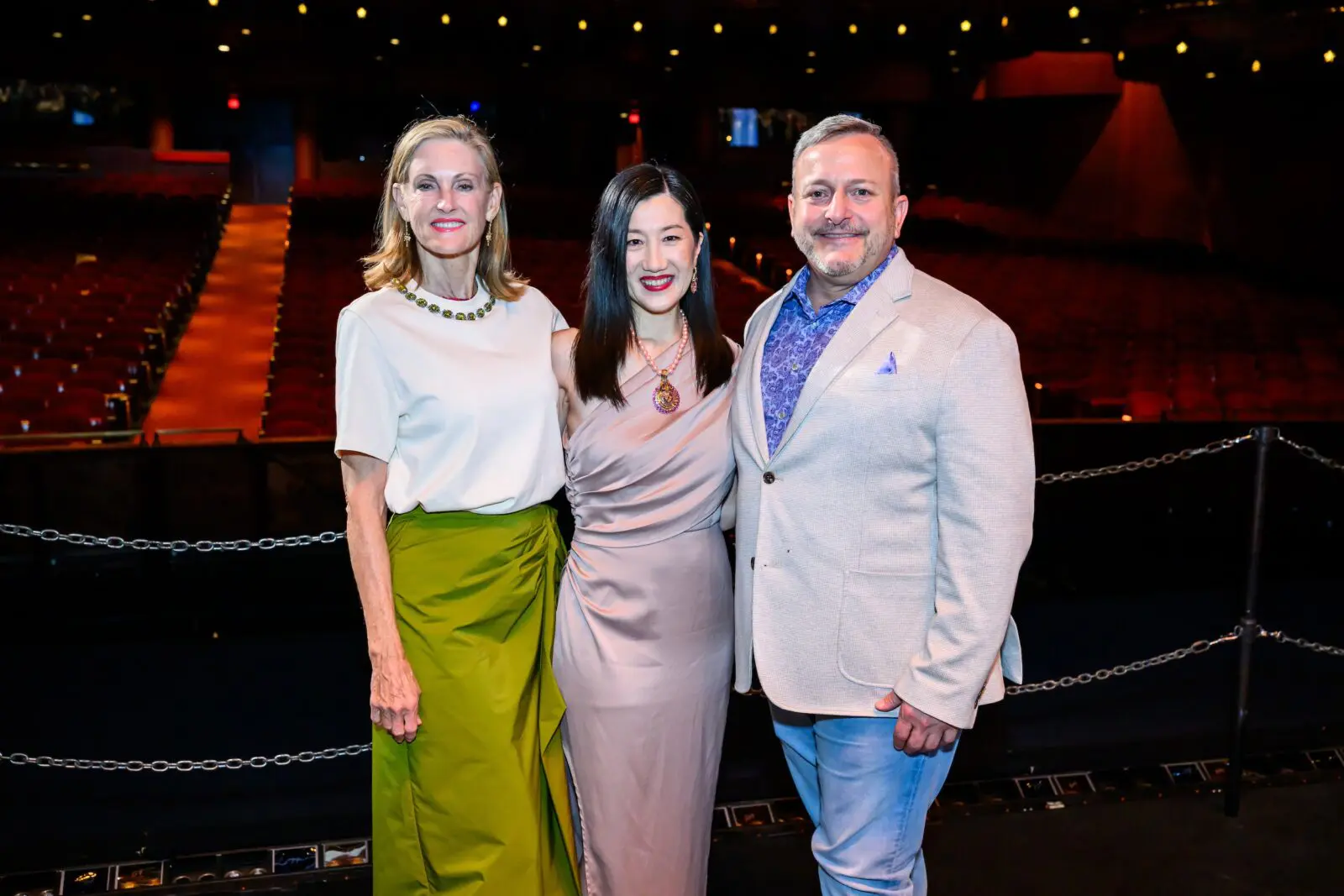 Stephanie Tsuru, Sonja Kostich, Chad Libertus at Houston Ballet's opening night dinner on stage at Wortham Theater Center  (Photo by Michelle Watson, CatchlightGroup.com)