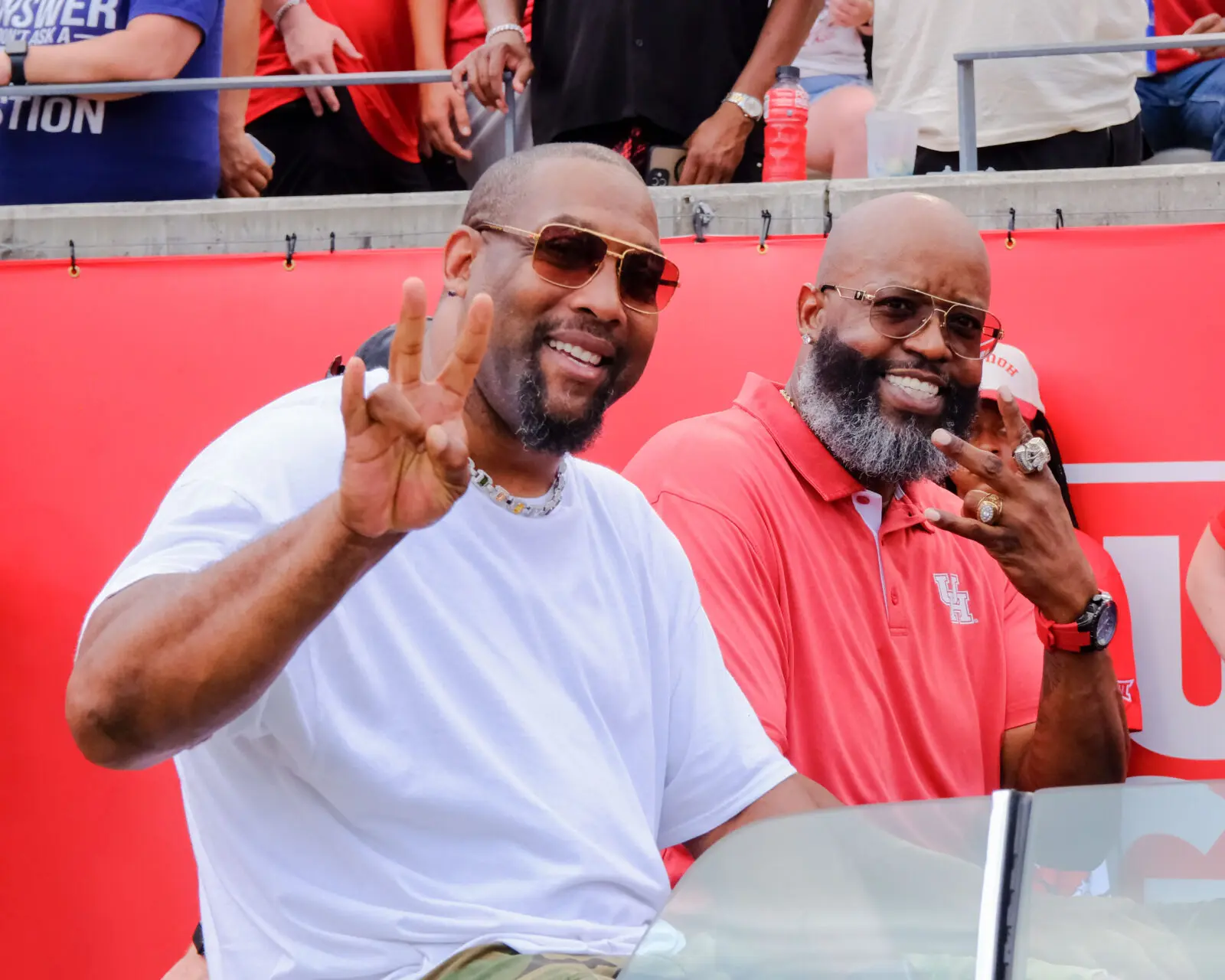 University of Houston football alums Antowain Smith and Wilbert Brown enjoyed their slab ride — and pure Houston entrance. (Photo by F. Carter Smith)
