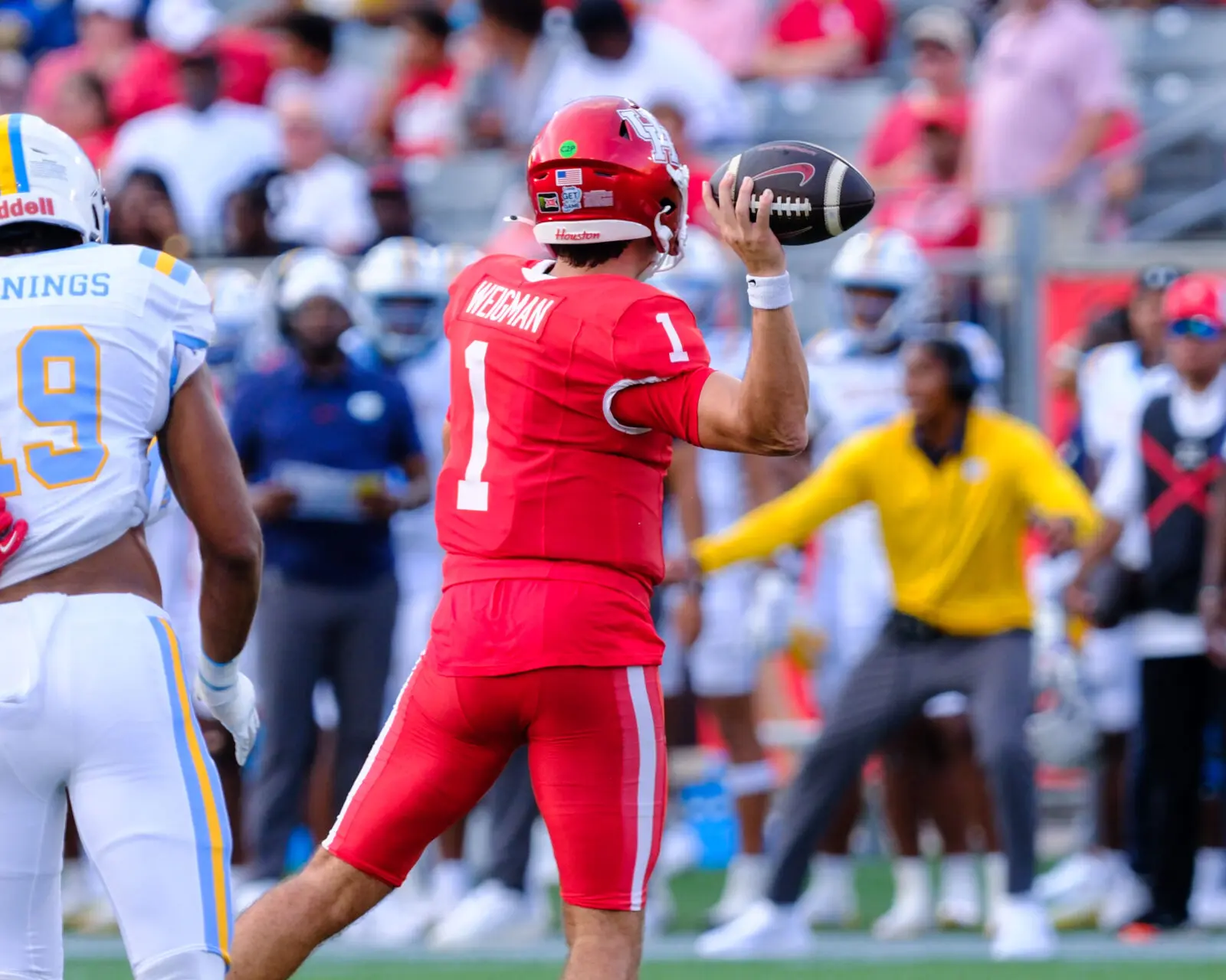 University of Houston quarterback Conner Weigman is good throwing on the run too. (Photo by F. Carter Smith)