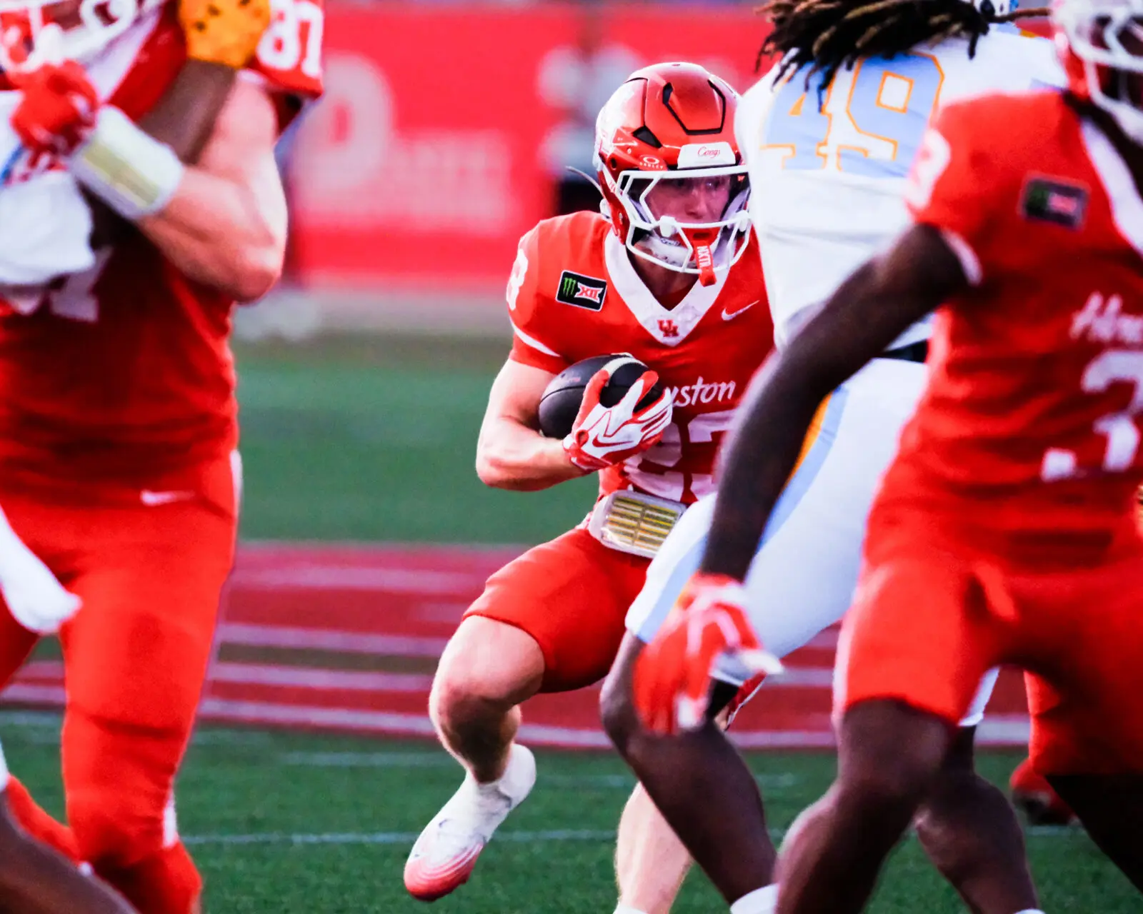 University of Houston freshman running back John Hebert runs hard and breaks tackles.University of Houston freshman quarterback Keisean Henderson has a quick release. (Photo by F. Carter Smith)