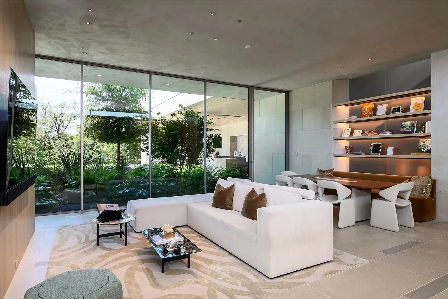 The central living spaces feature glassy, light-flooded walls. (Photo by Stephen Reed Photography)