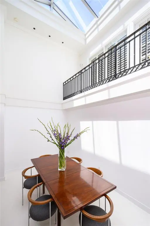 Highlights include a 21-foot skylight above the dining room.
