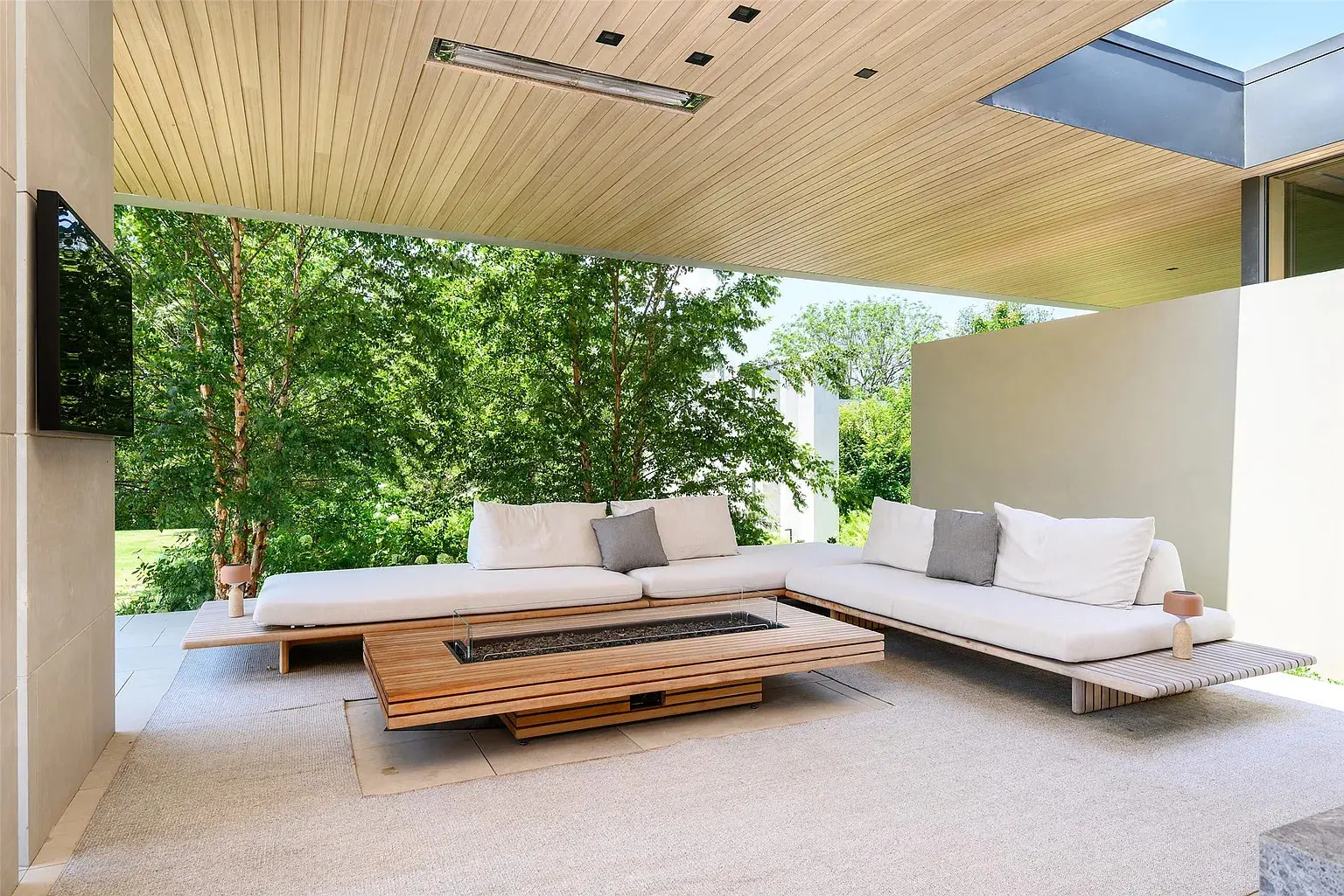 There are more than 5,000 square feet of covered terraces, in addition to a custom pool and spa set amidst the verdant grounds. (Photo by Stephen Reed Photography)