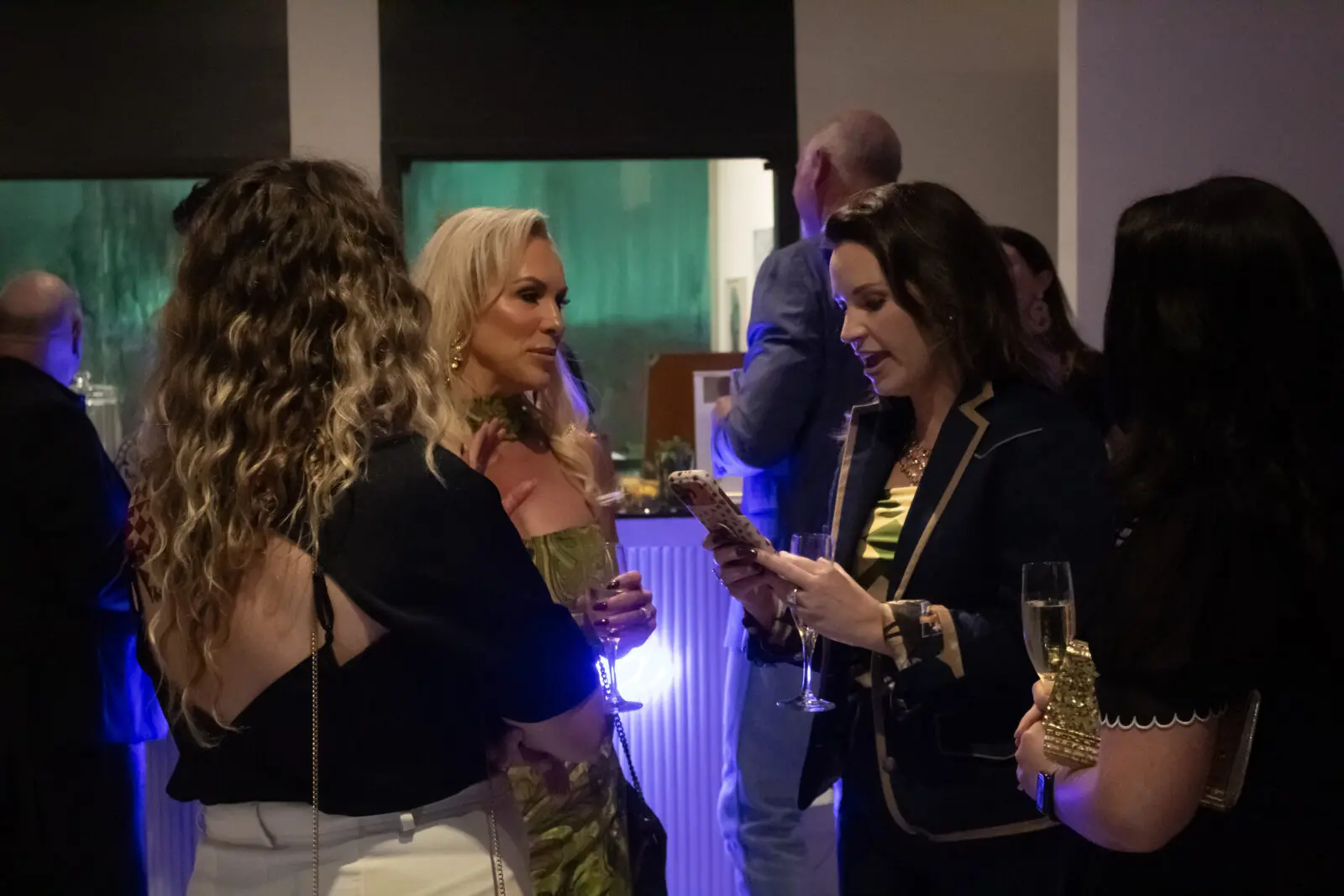 Event organizer Christi Braswell chats with guests at the Marilyn Effect. (Photo by Delast Gordon)