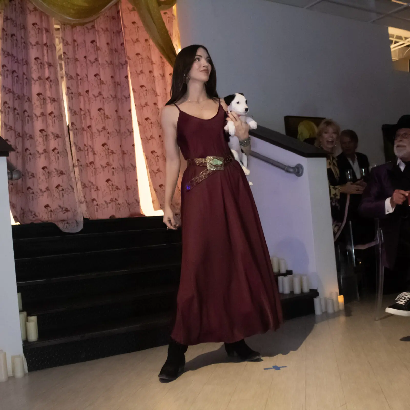 Heather Celest Dyer, puppy in hand, was among the night's notable runway models. (Photo by Delast Gordon)