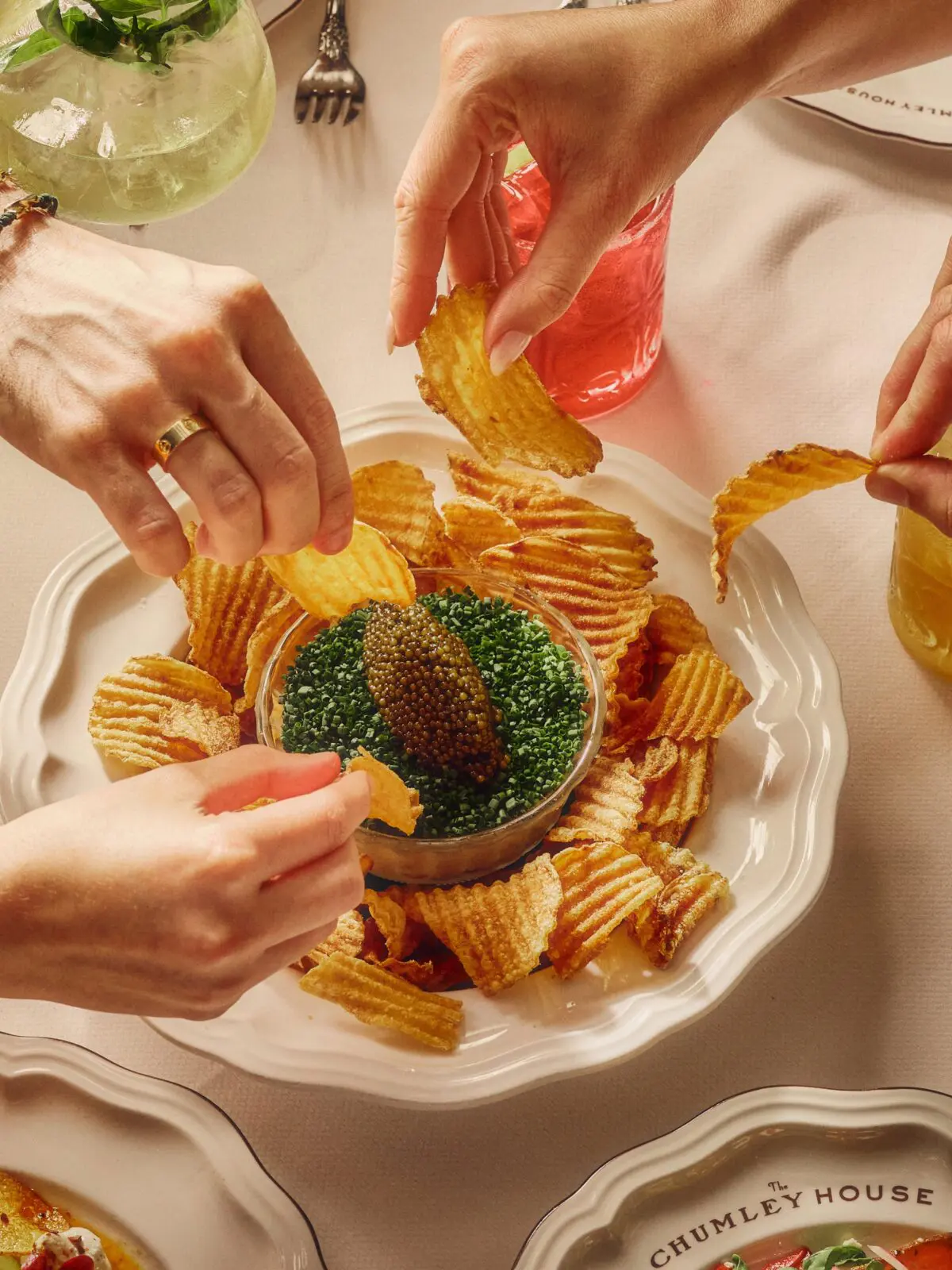 The Chumley House offers a full ounce of Golden Ossetra caviar for $99 as an add-on to its Artichoke & Caramelized Onion Dip with malt vinegar chips. (Courtesy of The Chumley House)