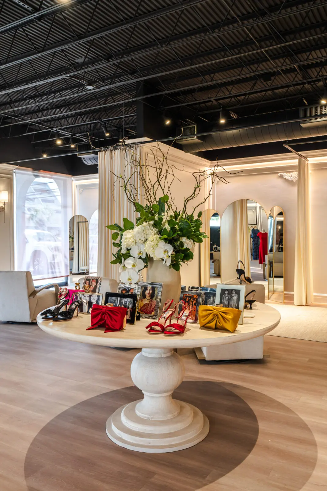 Family photos and accessories line the center table in the Sachin Bibi showroom in Houston. (Photo by Michael Anthony)