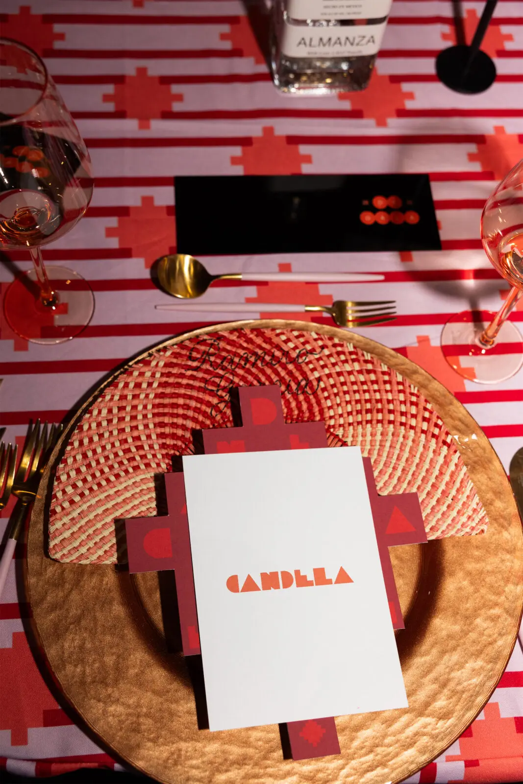 Electric shades of red, pink, and orange drenched the dining room, with intricate, elaborate, and magical florals by Concepto Studio's Pablo Arellano and custom tablecloths that evoked the colorful streets of Cartagena. (Photo by Kaitlin Saragusa Kellerman for BFA)