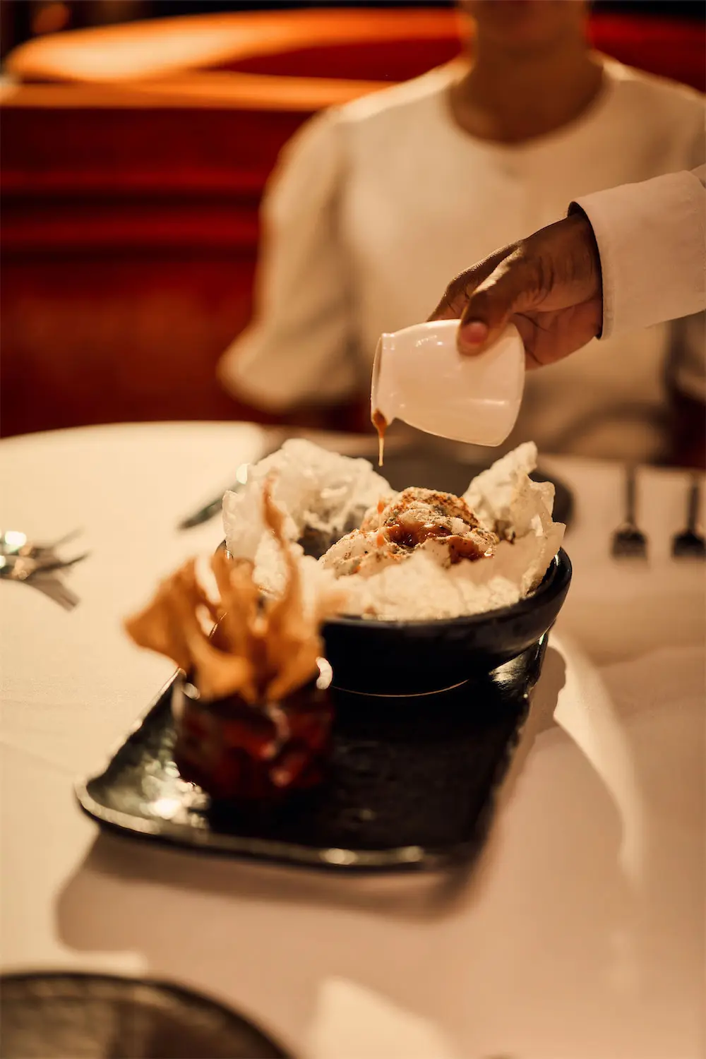 At Docent, the spicy tuna tartare was a favorite of the evening, featuring a tableside presentation of pouring the peanut ponzu over togarashi cotton candy and mixing with the other ingredients. (Photo by Harwood Hospitality)