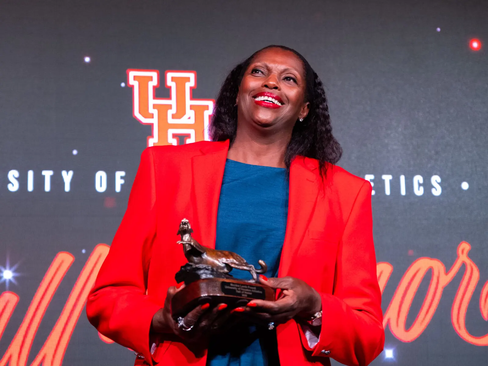 University of Houston basketball star Monica Lamb Powell went into the Hall of Honor wearing the red Chuck Taylors her late dad always wore. 