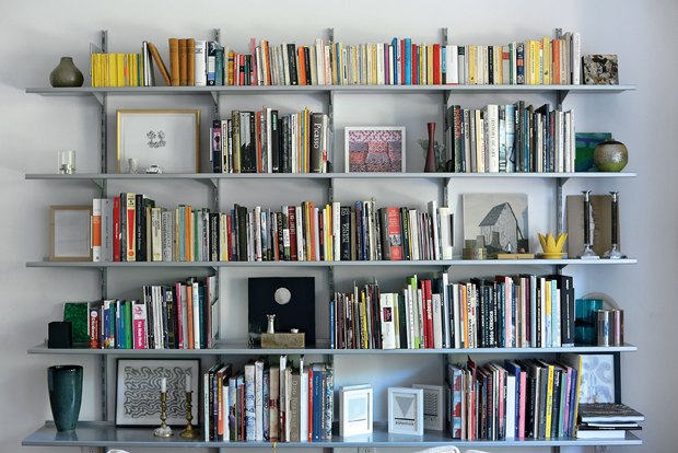 Bookshelves brim with art volumes and exhibition catalogs mostly used when Hettig wrote for illustrious art journals like Artforum and Kunstforum in the 1990s.