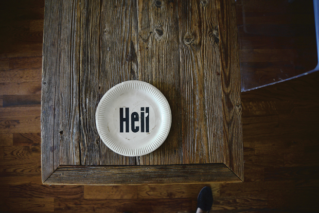 Looks like hell (condition issues), but it’s Heil on a paper plate by German artist Bernhard Johannes Blume.