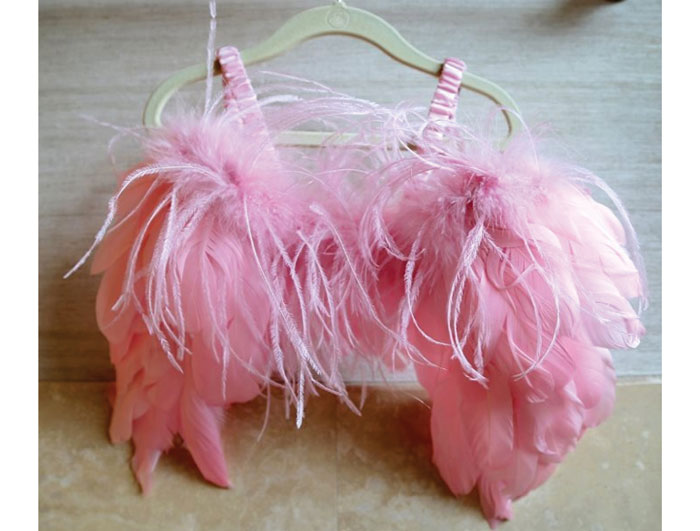 A sweet pair of angel wings hangs near her boudoir.