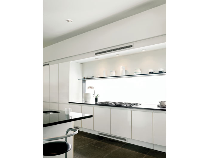 Designed by German kitchen maker Allmilmo, the kitchen displays Shio Kusaka ceramics and Peter Shire mugs.