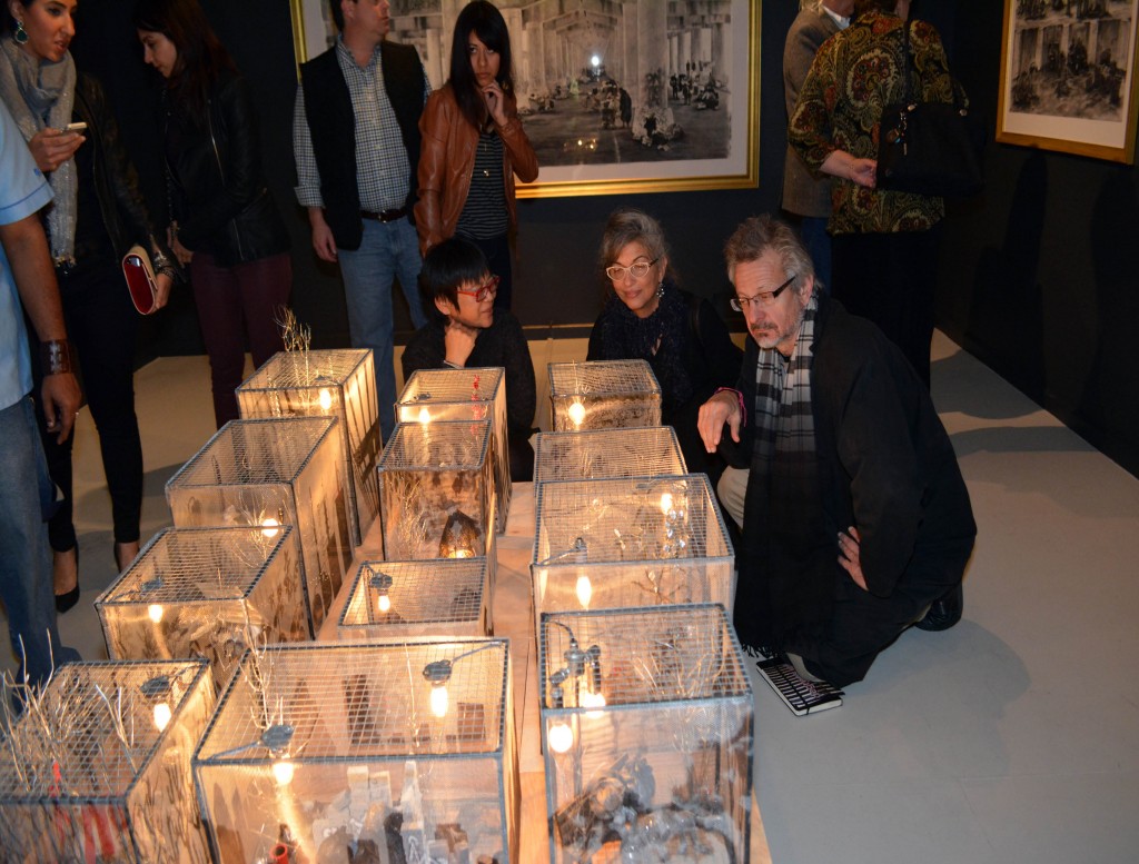 Mary Jenewein's dioramas and charcoal drawings confront American issues. 