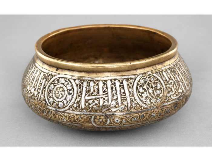 Silver-inlaid brass bowl with stylized calligraphy, 14th-century Egypt or Syria. The al-Sabah Collection, Kuwait. 