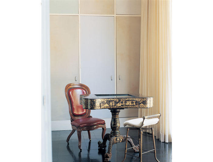 In Dominque de Menil's dressing room, Charles James applied a brushed paint treatment on the wardrobe doors in an array of grayed pastel hues that has survived decades without repainting. 