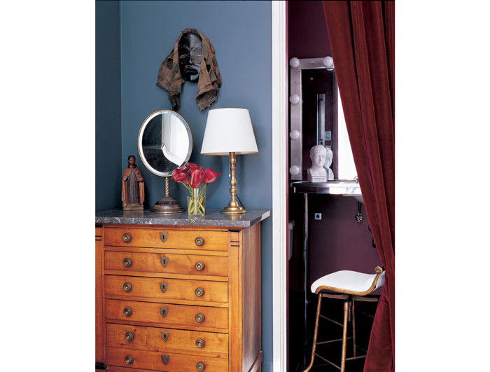 Mrs. de Menil's modest bath was tucked away behind this strangely sumptuous red velvet curtain. 