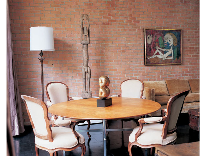 In John de Menil's study, Victor Brauner's gilded-bronze sculpture, "Sign", rests on a teak and chrome-plated table, circa the 1960s, made by L.D. Dreyer for the de Menil's office at the University of St. Thomas