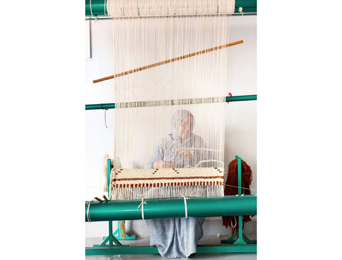 Carpet weavers in the artisan atelier in Marrakech