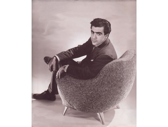 Vladimir Kagan in the early
days, sitting in his barrel chair
design.