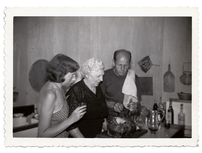 Not the classic Thanksgiving dinner: Lee Krasner, Stella Pollock and Jackson Pollock carving a turkey, in the Pollock/Krasner home in the Springs, East Hampton, New York, 1950. Jackson Pollock and Lee Krasner papers.