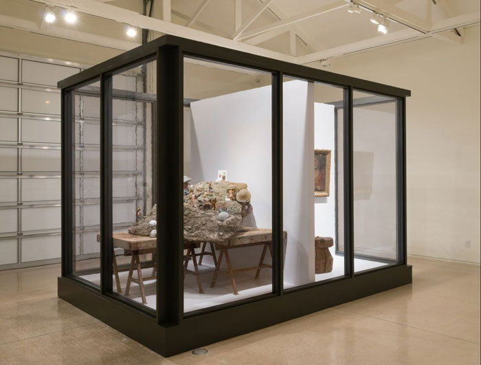 The vitrine "It Takes a Village," 2015, also gave rise to the show's title. It's filled with Diaz's signature mix of high and low, from a cheap plastic radio to Mexican colonial painting. 