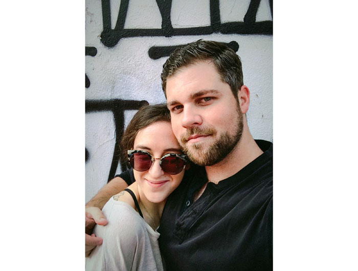 Cecilia & Garrett in front of the Retna graffiti mural