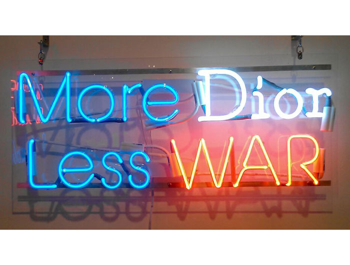 "More Dior, Less War," is on of Diaz's classic neon signs, post Dan Flavin and before Tracey Emin, an example of earlier work (but not included in this show).