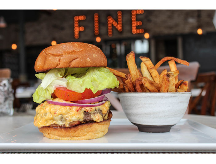 Low Country Burger at Bradley's Fine Diner. Crispy gaunciale, kale, pimento cheese and hand-cut fries at Bradley's Fine Diner. Photo courtesy Andrea Weir. 