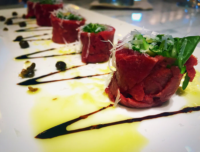 Beef Sushi – arugula, fried capers and truffle oil wrapped in rare filet mignon