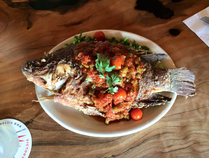 Whole crispy, organic Costa-Rican tilapia served with Spanish rice and your choice of sauce 