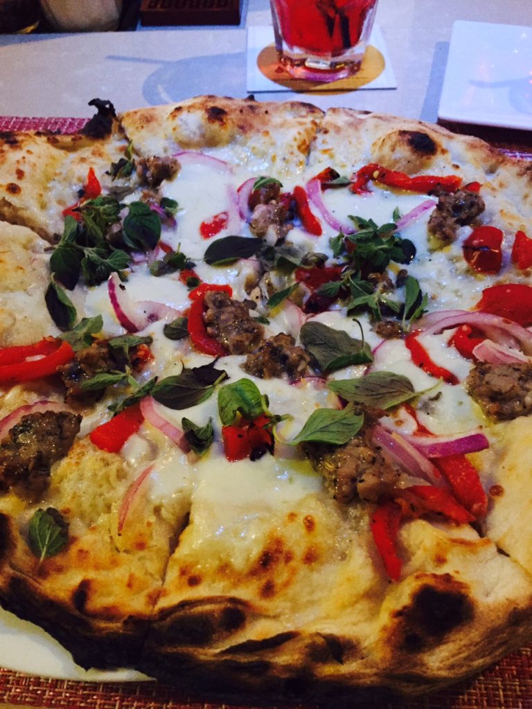 Sicilian sausage and roasted red peppers make this pie.
