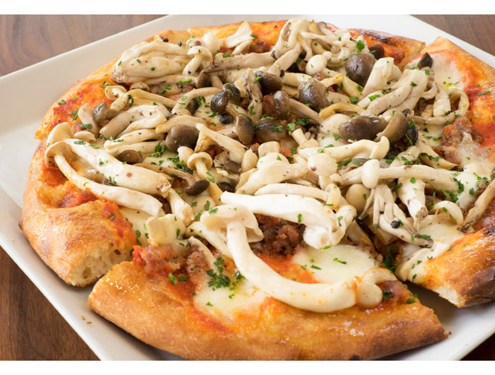 Italian sausage & beech mushroom pizza at Bistro Menil. Italian sausage, roasted beech mushrooms, tomato sauce and fresh mozzarella. 