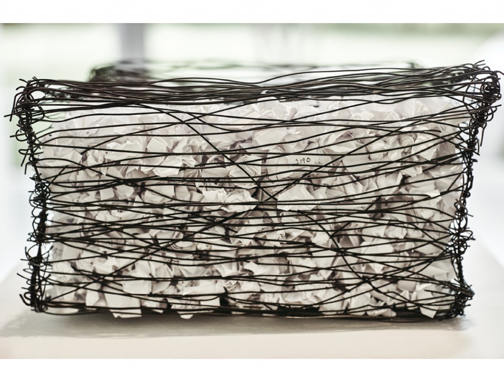 Nicosia’s 2190 #2, 2014, formed from bailing wire and paper, contains a 1/6 version of the space’s wall drawing.