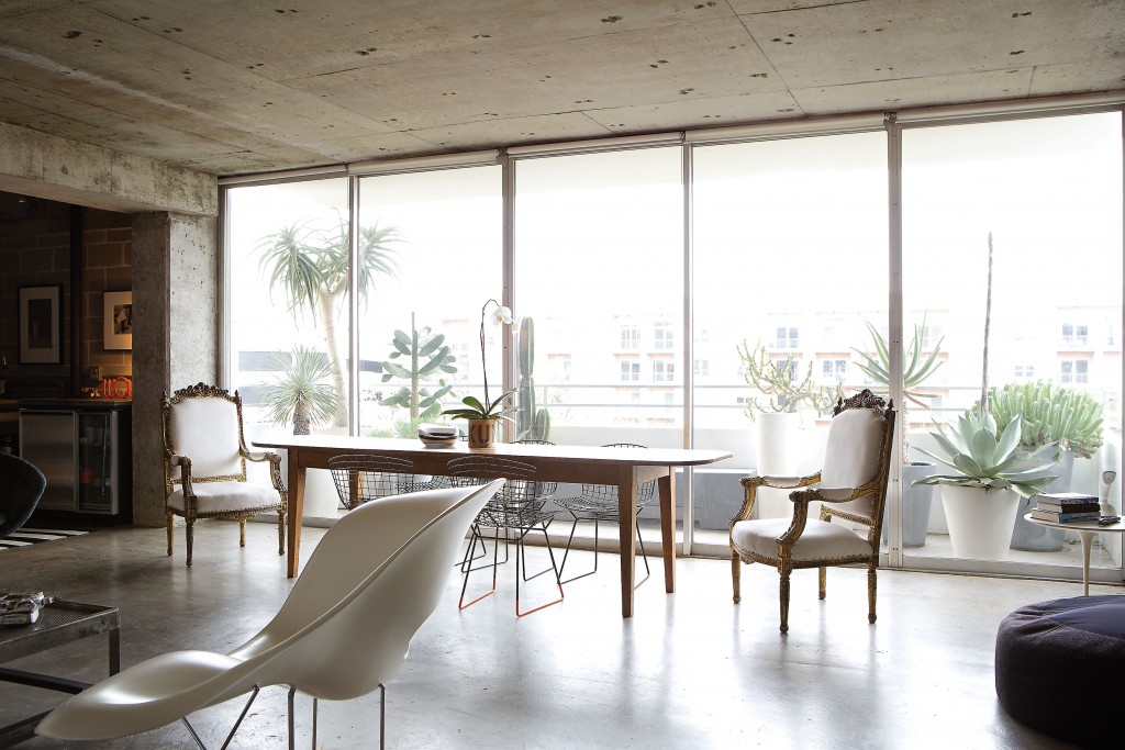 In the dining area, the antique farmhouse table is from Twenty Six Twenty. Pair of Italianate chairs from Antiques on Dunlavy (now Antiques & Interiors at The Pavilion). Bertoia chairs from Cast + Crew in Marfa.
Vintage Eames lounge chair. Hill’s balcony cactus garden includes an 8 1/2-foot agave named Javier Bardem.