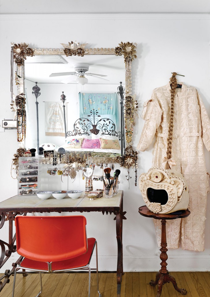 In a bedroom nook, a vintage chair dialogues with the artist’s tile-and-metal dressing table — another example of husband Memo’s talent.