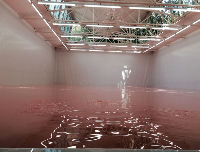 In the Swiss Pavilion, Pamela Rosenkrantz’s installation: a pool of pinkish-white liquid meant to mimic the standardized northern European skin tone.