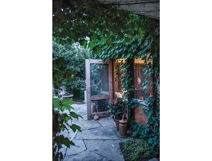 A screened-in porch off the master bedroom opens onto the backyard and is one of Paula Minnis' favorite places to relax and watch the children play.