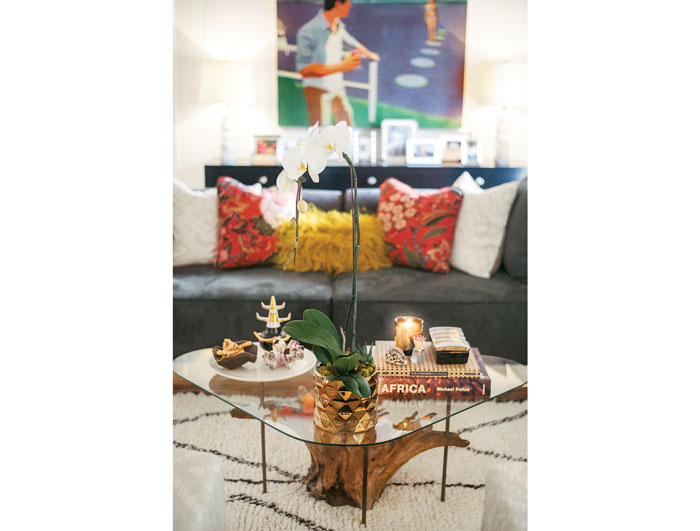 In the living room, a vintage tree-trunk table that belonged to Todd before the couple married. Rug from Morocco.