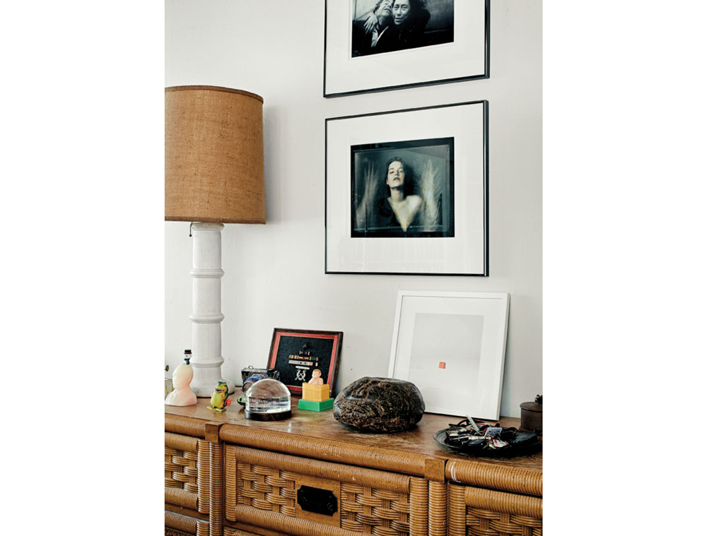 In the dining/work room, a photo by Czech Republic artist Pavel Banka. Above it, a photo by Swedish artist Anders Petersen. On the console are Baldwin’s medals from the Korean War, including a Purple Heart. Stone face from Borneo. The Vision Award was presented to them by The Center for Photography at Woodstock. Wax candle of Putin’s head.