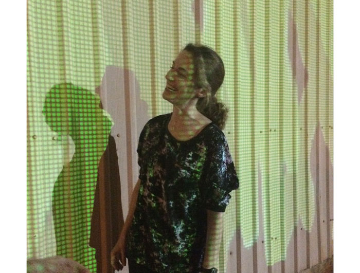 Hunter basks in the glow from her projection. Photo Mary Margaret Hansen. 