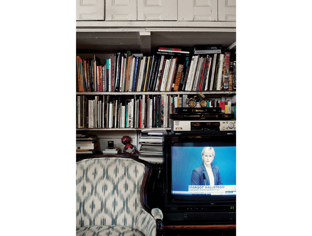 In the living room, some of the 1,000-plus books the couple owns.
