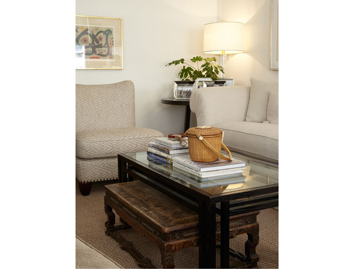 Also in the living area: an antique Chinese table, basket from Nantucket, custom designed chair by Joe Don Watts and an early lithograph by Joan Miró from Mary Ella’s collection.