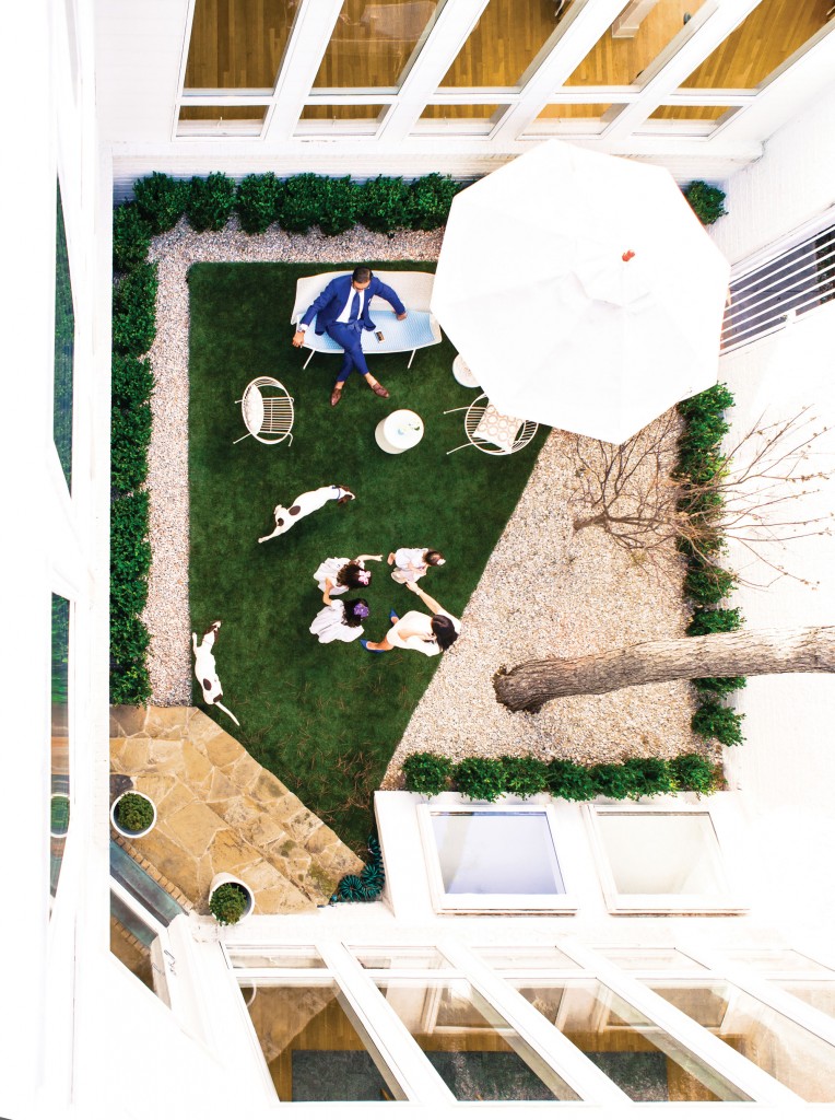 View from the rooftop into
the center courtyard below,
with the Shaikh family and
their English pointers, Jack
and Jill.
